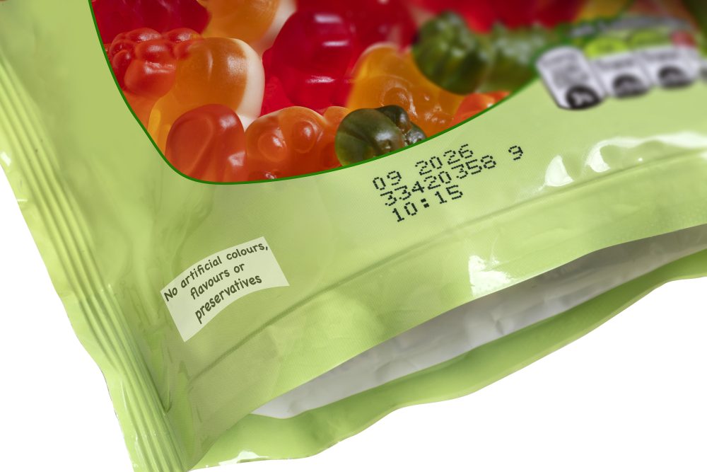 Batch code printing on a candy packet